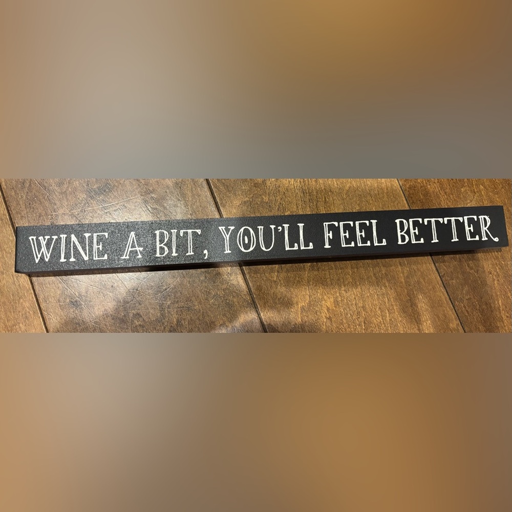 Black Wooden Sign with Wine Inspired Text